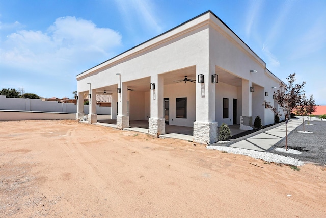 5624 Laredo, Rio Rancho, NM 87144 - view of front facade with a ceiling fan, stucco siding, and stone siding