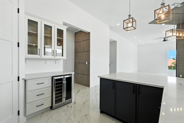 5624 Laredo, Rio Rancho, NM 87144 - kitchen with wine cooler, white cabinets, light countertops, and recessed lighting