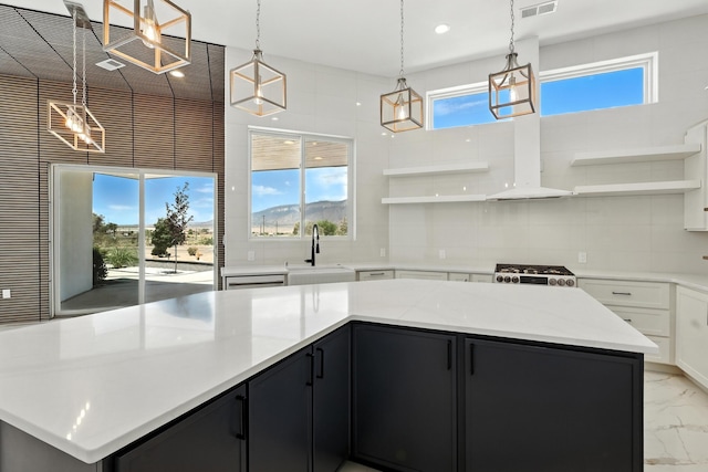 5624 Laredo, Rio Rancho, NM 87144 - kitchen featuring open shelves, ventilation hood, dark cabinets, light marble finish flooring, and backsplash