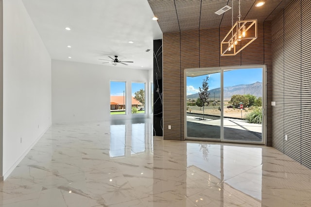 5624 Laredo, Rio Rancho, NM 87144 - unfurnished room featuring a towering ceiling, marble tiled flooring, recessed lighting, a chandelier, and ceiling fan