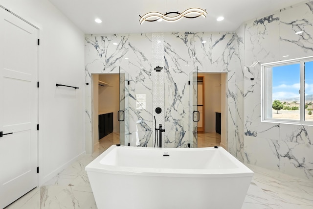 5624 Laredo, Rio Rancho, NM 87144 - full bath with stone wall, recessed lighting, a freestanding bath, a marble finish shower, and marble tiled floors