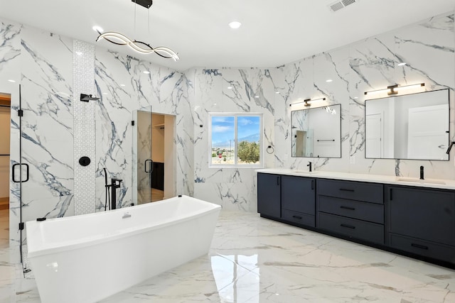 5624 Laredo, Rio Rancho, NM 87144 - full bath with stone wall, double vanity, a soaking tub, marble tiled flooring, and a marble finish shower