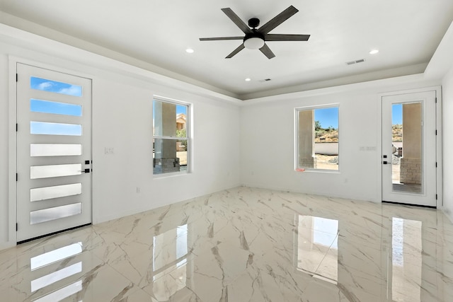 5624 Laredo, Rio Rancho, NM 87144 - foyer entrance featuring a tray ceiling, healthy amount of natural light, ceiling fan, and recessed lighting
