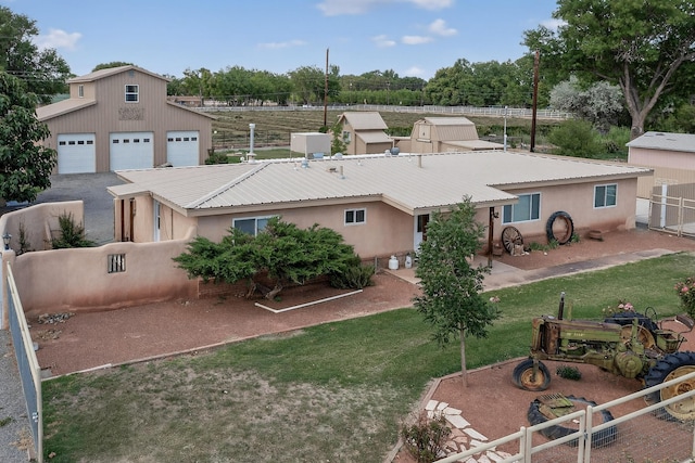 855 Foxcroft Loop, Bosque Farms, NM 87068 - back of house featuring stucco siding and a metal roof