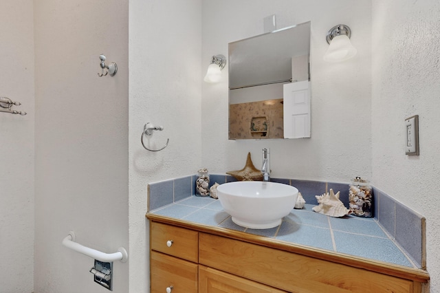 855 Foxcroft Loop, Bosque Farms, NM 87068 - bathroom with vanity and a textured wall