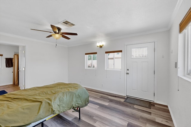 855 Foxcroft Loop, Bosque Farms, NM 87068 - entryway featuring ceiling fan, ornamental molding, and wood finished floors