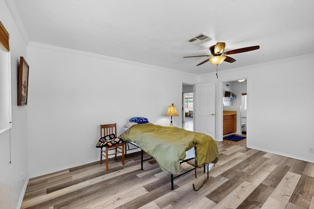 855 Foxcroft Loop, Bosque Farms, NM 87068 - bedroom featuring wood finished floors, crown molding, ensuite bathroom, and a ceiling fan