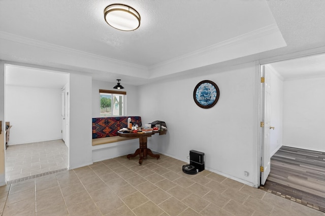 855 Foxcroft Loop, Bosque Farms, NM 87068 - hallway featuring a tray ceiling, ornamental molding, light tile patterned floors, and a textured ceiling