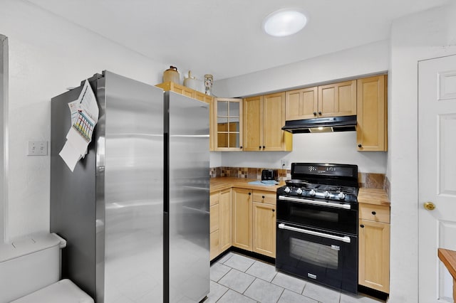 855 Foxcroft Loop, Bosque Farms, NM 87068 - kitchen with double oven range, freestanding refrigerator, under cabinet range hood, and light brown cabinets