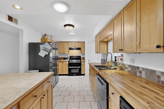 855 Foxcroft Loop, Bosque Farms, NM 87068 - kitchen featuring range, black dishwasher, freestanding refrigerator, under cabinet range hood, and wood counters
