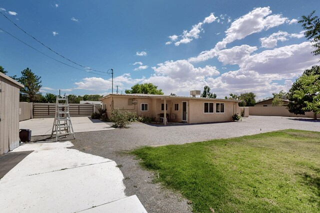 855 Foxcroft Loop, Bosque Farms, NM 87068 - back of property featuring a patio and stucco siding
