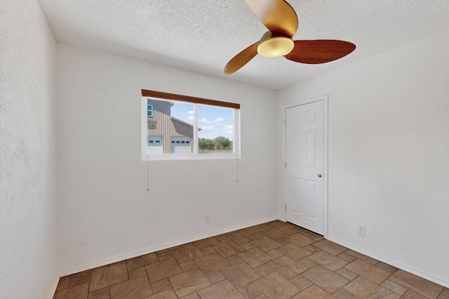 855 Foxcroft Loop, Bosque Farms, NM 87068 - spare room featuring a ceiling fan, stone finish floors, and a textured ceiling