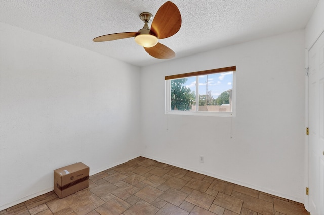 855 Foxcroft Loop, Bosque Farms, NM 87068 - empty room with ceiling fan, light stone finish flooring, and a textured ceiling