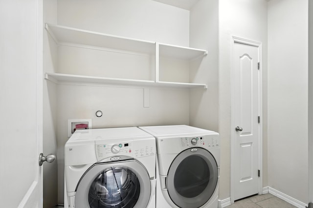 6903 Wrangell Loop NE, Rio Rancho, NM 87144 - washroom with washing machine and dryer and light tile patterned floors