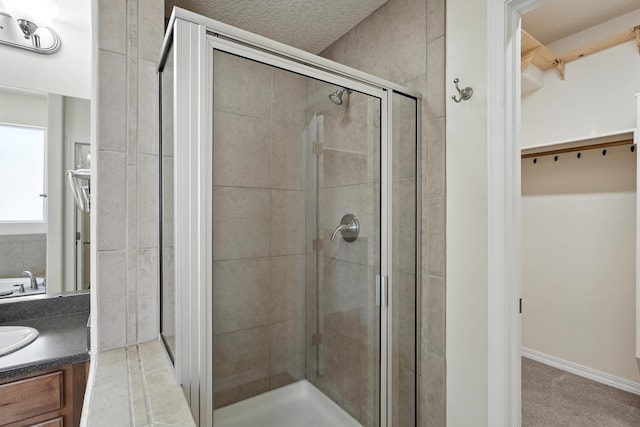 6903 Wrangell Loop NE, Rio Rancho, NM 87144 - bathroom with a walk in closet, a shower stall, and vanity
