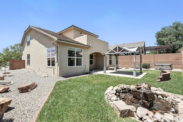 6903 Wrangell Loop NE, Rio Rancho, NM 87144 - rear view of house with a hot tub, a fenced backyard, a patio area, stucco siding, and a pergola
