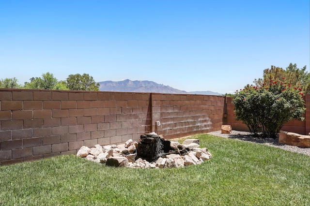6903 Wrangell Loop NE, Rio Rancho, NM 87144 - fenced backyard with a mountain view