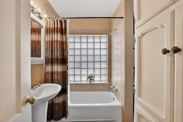 302 Crestview Dr SW, Albuquerque, NM 87105 - bathroom with shower / bath combo with shower curtain and a sink
