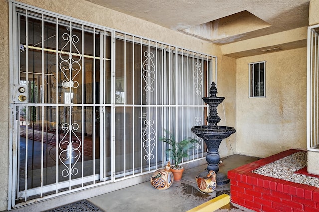 302 Crestview Dr SW, Albuquerque, NM 87105 - view of exterior entry featuring stucco siding