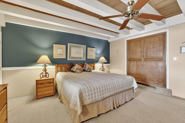 302 Crestview Dr SW, Albuquerque, NM 87105 - bedroom featuring light carpet, beam ceiling, and ceiling fan