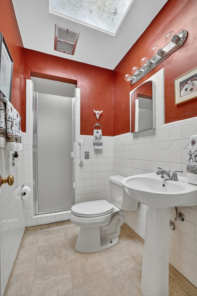 302 Crestview Dr SW, Albuquerque, NM 87105 - full bath with tile walls, a stall shower, and a wainscoted wall