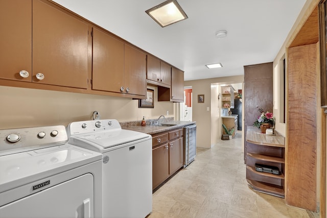 302 Crestview Dr SW, Albuquerque, NM 87105 - washroom featuring independent washer and dryer, cabinet space, beverage cooler, and light flooring