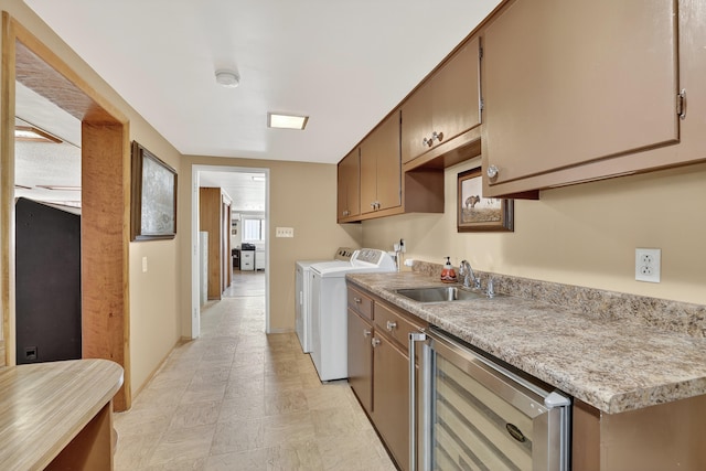 302 Crestview Dr SW, Albuquerque, NM 87105 - kitchen featuring washer and clothes dryer, wine cooler, and light countertops