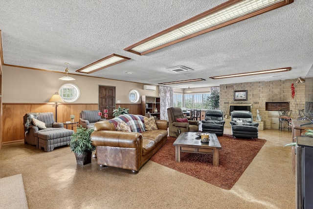 302 Crestview Dr SW, Albuquerque, NM 87105 - living room with a wainscoted wall, a textured ceiling, a wall mounted air conditioner, and a fireplace