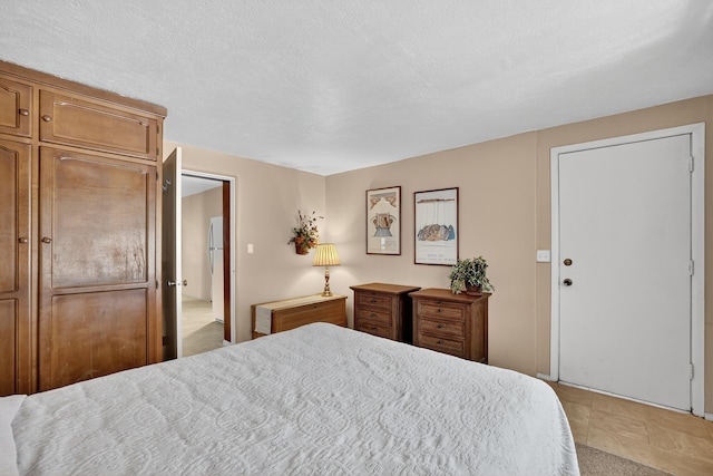 302 Crestview Dr SW, Albuquerque, NM 87105 - bedroom with freestanding refrigerator