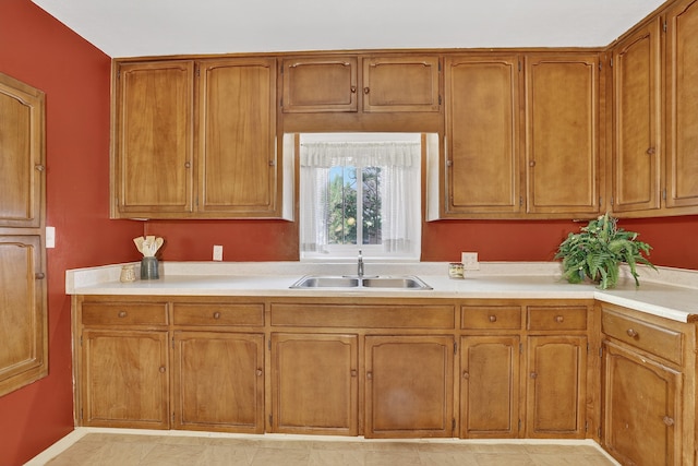 302 Crestview Dr SW, Albuquerque, NM 87105 - kitchen featuring light countertops and brown cabinets