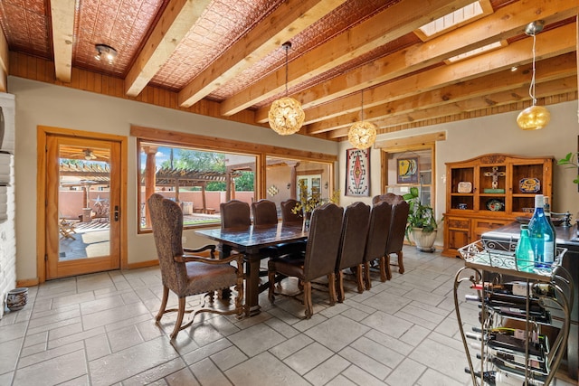 704 Tyler Rd NW, Los Ranchos, NM 87107 - dining space with beamed ceiling and a chandelier