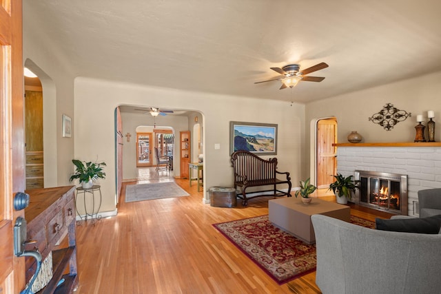 704 Tyler Rd NW, Los Ranchos, NM 87107 - living area with ceiling fan, arched walkways, and light wood-type flooring