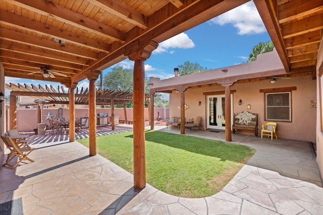 704 Tyler Rd NW, Los Ranchos, NM 87107 - fenced backyard featuring a pergola, ceiling fan, and a patio