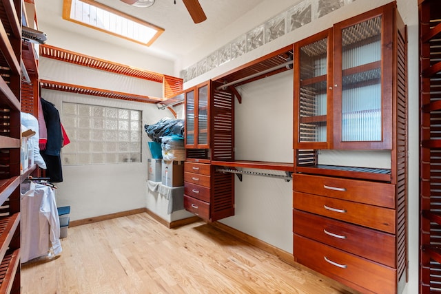 704 Tyler Rd NW, Los Ranchos, NM 87107 - spacious closet featuring wood finished floors and a ceiling fan