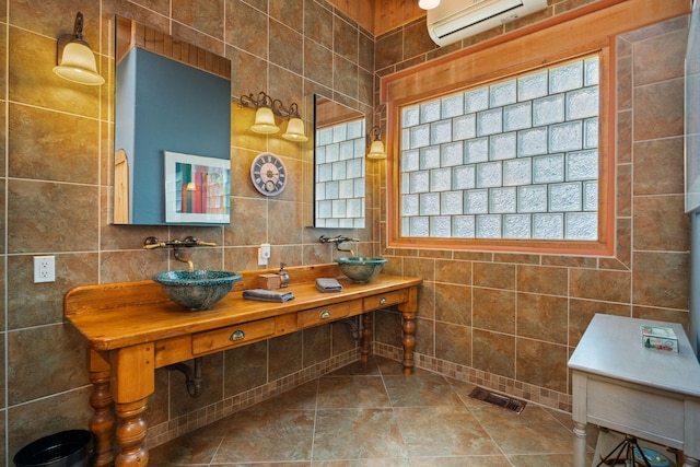 704 Tyler Rd NW, Los Ranchos, NM 87107 - bathroom with tile walls and a wall mounted AC