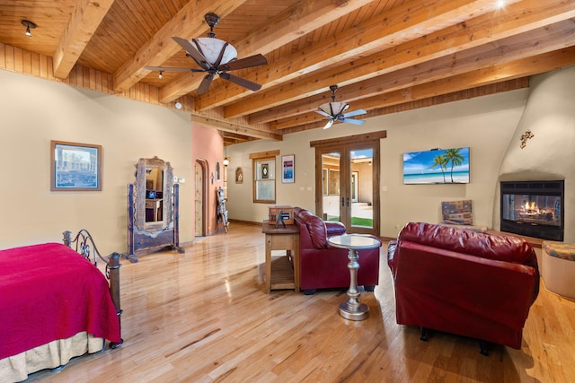 704 Tyler Rd NW, Los Ranchos, NM 87107 - living room with a large fireplace, a wood ceiling with exposed beams, light wood-style flooring, and ceiling fan