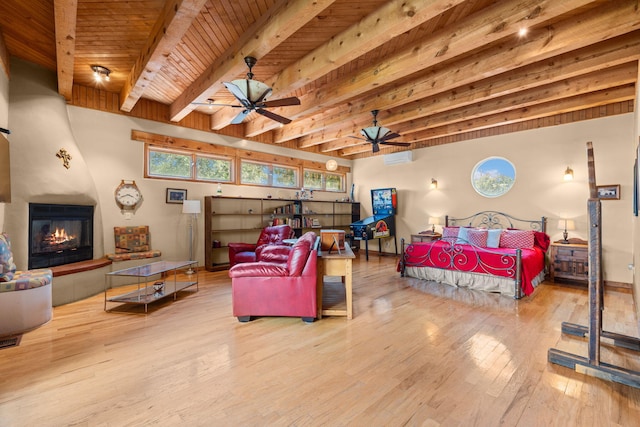 704 Tyler Rd NW, Los Ranchos, NM 87107 - bedroom featuring hardwood / wood-style flooring, a large fireplace, a wooden ceiling with exposed beams, and a wall mounted AC