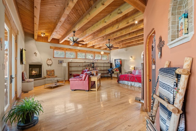 704 Tyler Rd NW, Los Ranchos, NM 87107 - living area with ceiling fan, a large fireplace, a wood ceiling with exposed beams, and light wood-style flooring