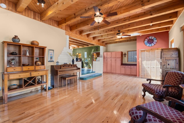 704 Tyler Rd NW, Los Ranchos, NM 87107 - living area featuring a wood ceiling with exposed beams, a ceiling fan, and wood finished floors