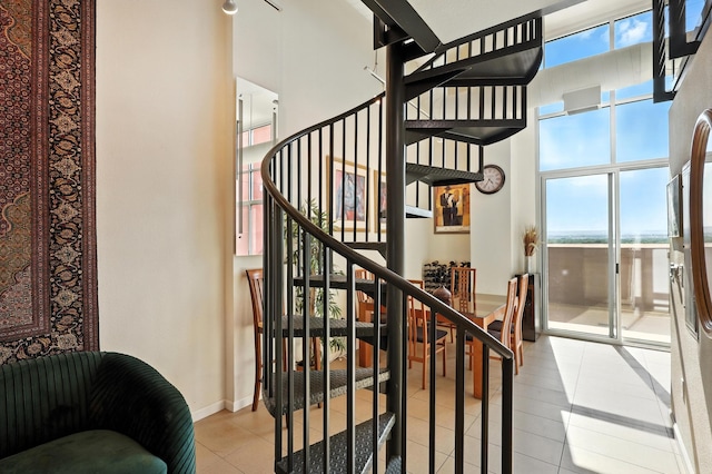 524 Central Ave SW # 803, Albuquerque, NM 87102 - stairway featuring tile patterned floors and a towering ceiling