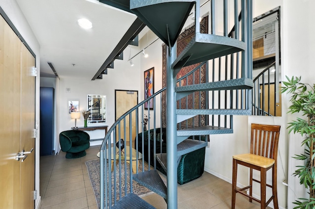 524 Central Ave SW # 803, Albuquerque, NM 87102 - staircase with rail lighting and tile patterned floors