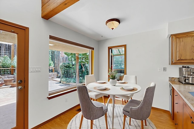 1865 Tramway Terrace Loop NE, Albuquerque, NM 87122 - dining area featuring light wood finished floors and beam ceiling