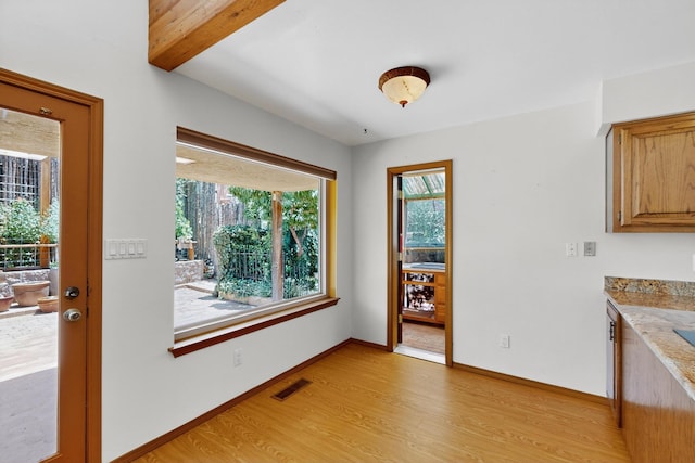 1865 Tramway Terrace Loop NE, Albuquerque, NM 87122 - dining area with light wood-style floors and beamed ceiling