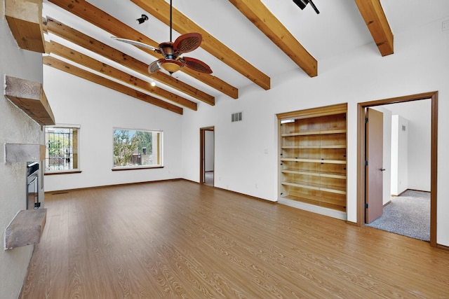 1865 Tramway Terrace Loop NE, Albuquerque, NM 87122 - unfurnished living room with a fireplace, a ceiling fan, and wood finished floors