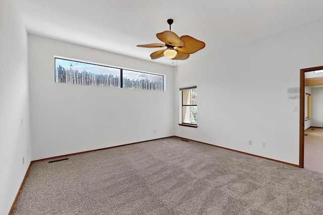 1865 Tramway Terrace Loop NE, Albuquerque, NM 87122 - carpeted empty room with plenty of natural light and a ceiling fan