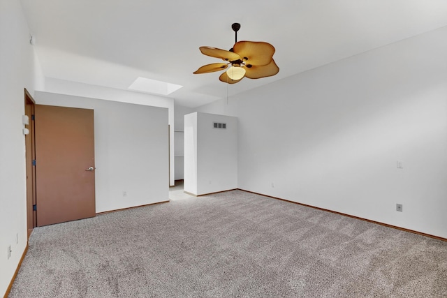 1865 Tramway Terrace Loop NE, Albuquerque, NM 87122 - empty room featuring a skylight, light colored carpet, and a ceiling fan