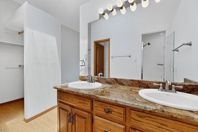 1865 Tramway Terrace Loop NE, Albuquerque, NM 87122 - full bath with double vanity, a shower, and wood finished floors