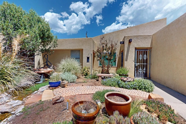 1865 Tramway Terrace Loop NE, Albuquerque, NM 87122 - property entrance with stucco siding