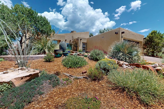 1865 Tramway Terrace Loop NE, Albuquerque, NM 87122 - southwest-style home with stucco siding and an attached garage
