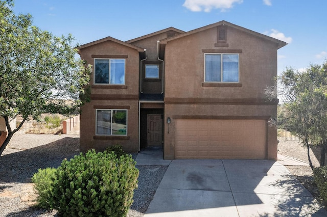 1324 Desert Paintbrush Loop, Rio Rancho, NM 87144 - view of front of property featuring stucco siding, driveway, and an attached garage